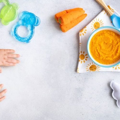 Healthy baby food background, organic carrot puree